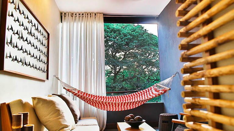 Each suite features regional artwork and fun details such as in-room hammocks. // © 2016 El Mangroove Hotel